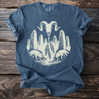 Blue t-shirt with graphic of ram skull, standing stones, foxes, and feathers.