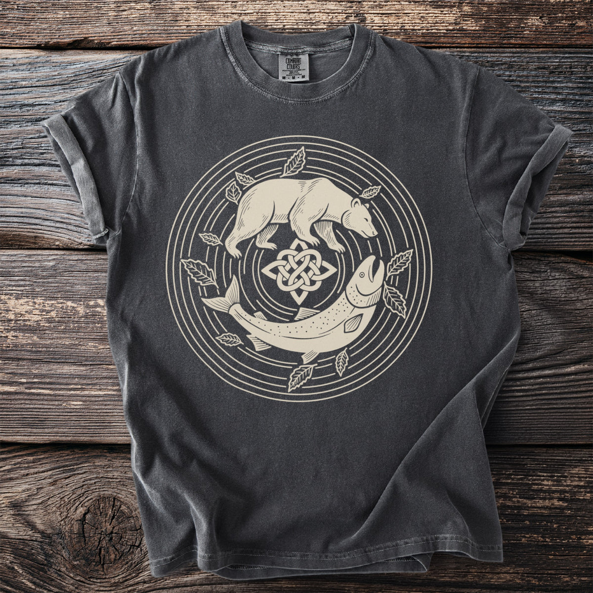 Dark gray t-shirt with a beige circular graphic of a bear and salmon with knotwork.