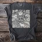 T-shirt with jungle animals and the text "respect the locals" in a floral design.