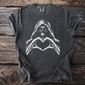 Dark t-shirt with grim reaper making heart shape with skeleton hands graphic.
