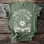 Green t-shirt with "Will o' the Wisp ghost light swamp folklore" graphic.