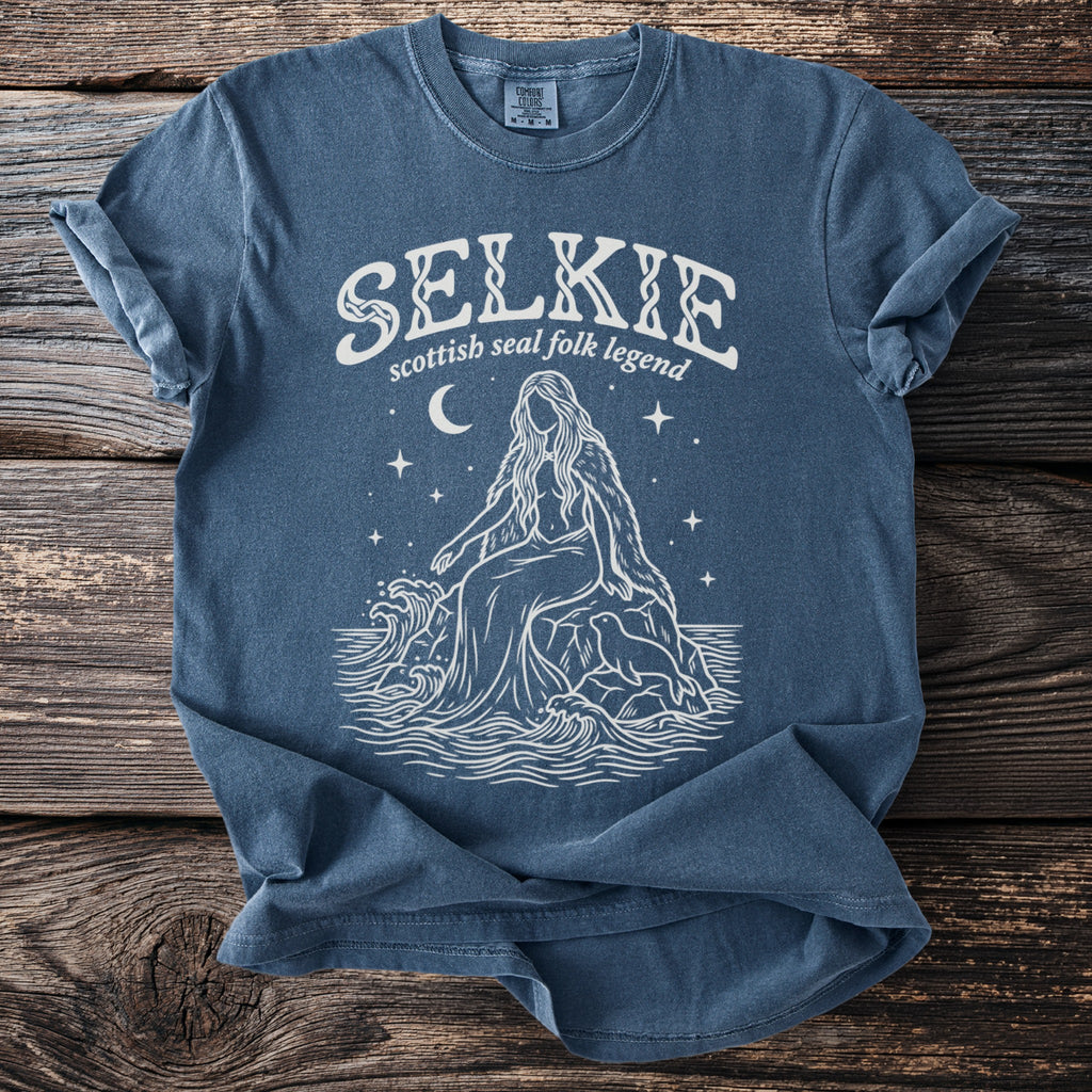 Selkie scottish seal folk legend graphic tee with woman, seal, waves, moon, and stars.