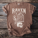 Brown t-shirt with Raven text art featuring a raven on a skull.