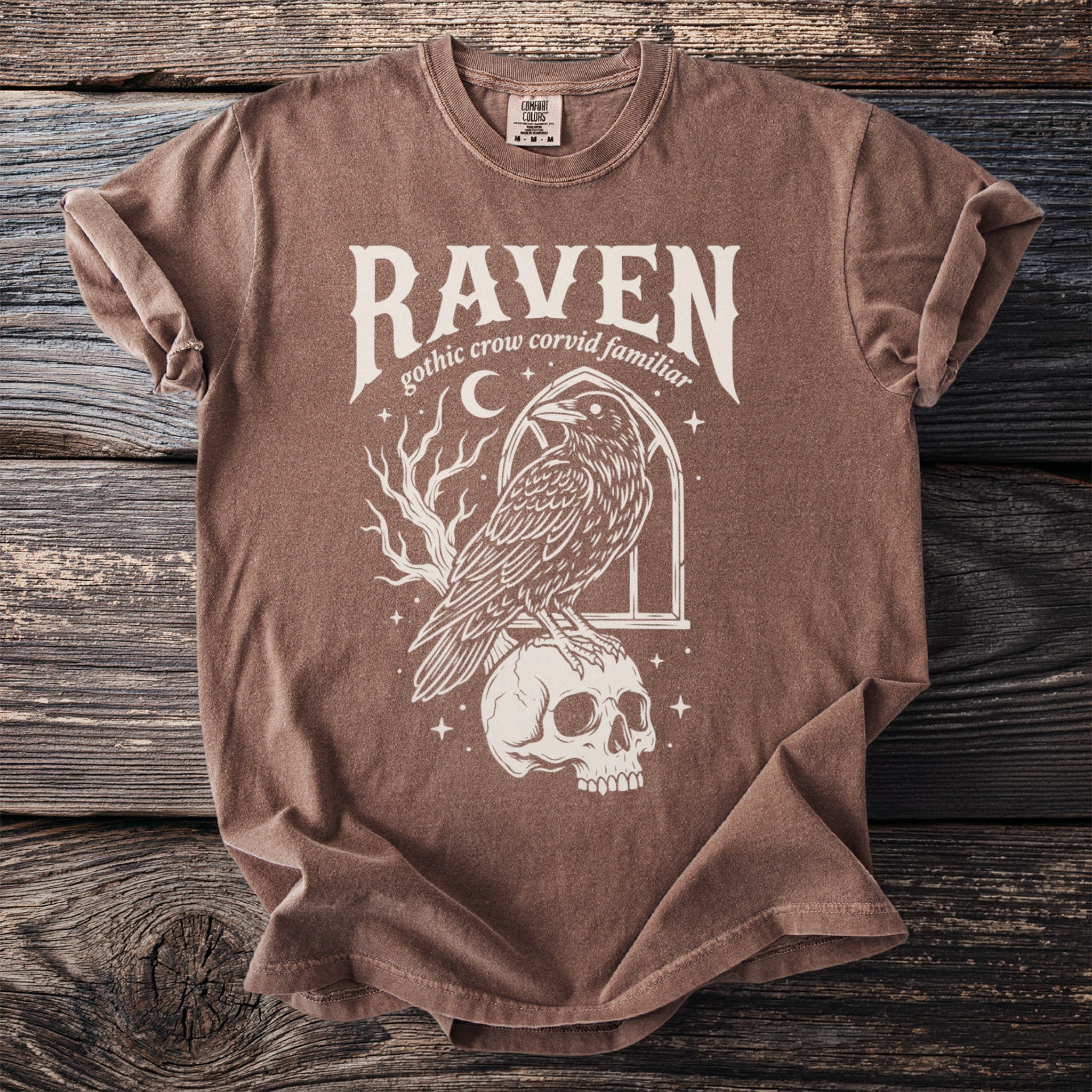 Brown t-shirt with Raven text art featuring a raven on a skull.