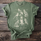 Green t-shirt with line drawings of birds of prey: the raptor cabinet.