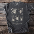Dark grey t-shirt with a scientific illustration of various arachnids and text.