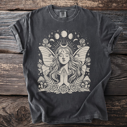 Dark grey t-shirt featuring a beige mystical fairy with wings, moon phases, and floral elements.