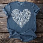 Blue t-shirt with white heart-shaped bat and floral design.