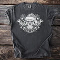 Dark gray t-shirt with white sugar skull, bat wings, Santa hat, and holly design.