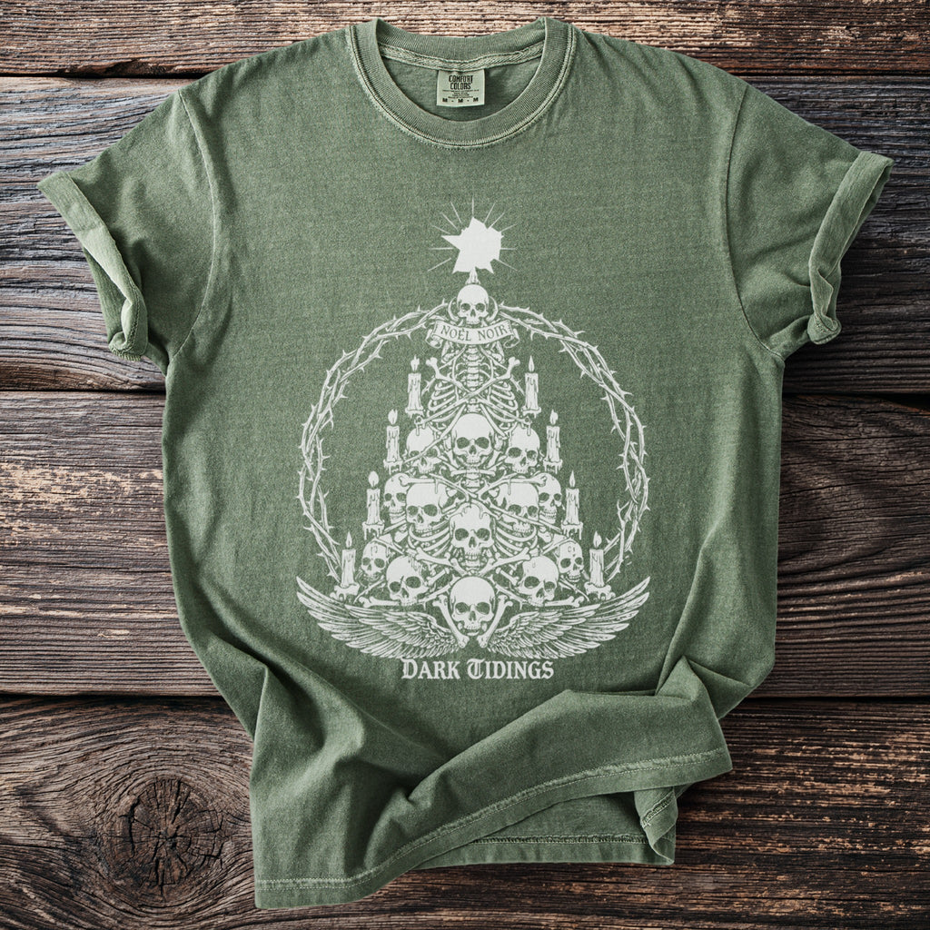 Green t-shirt with skeletal Christmas tree, skulls, candles, and "Dark Tidings" text.