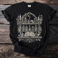 Black t-shirt with line art of an apothecary shelf filled with jars, books, and mystical items.