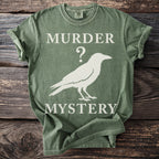 Green t-shirt with "Murder Mystery" and a crow graphic.