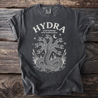 Dark t-shirt with white graphic of a multi-headed serpent, text "HYDRA greek mythology many headed serpent".