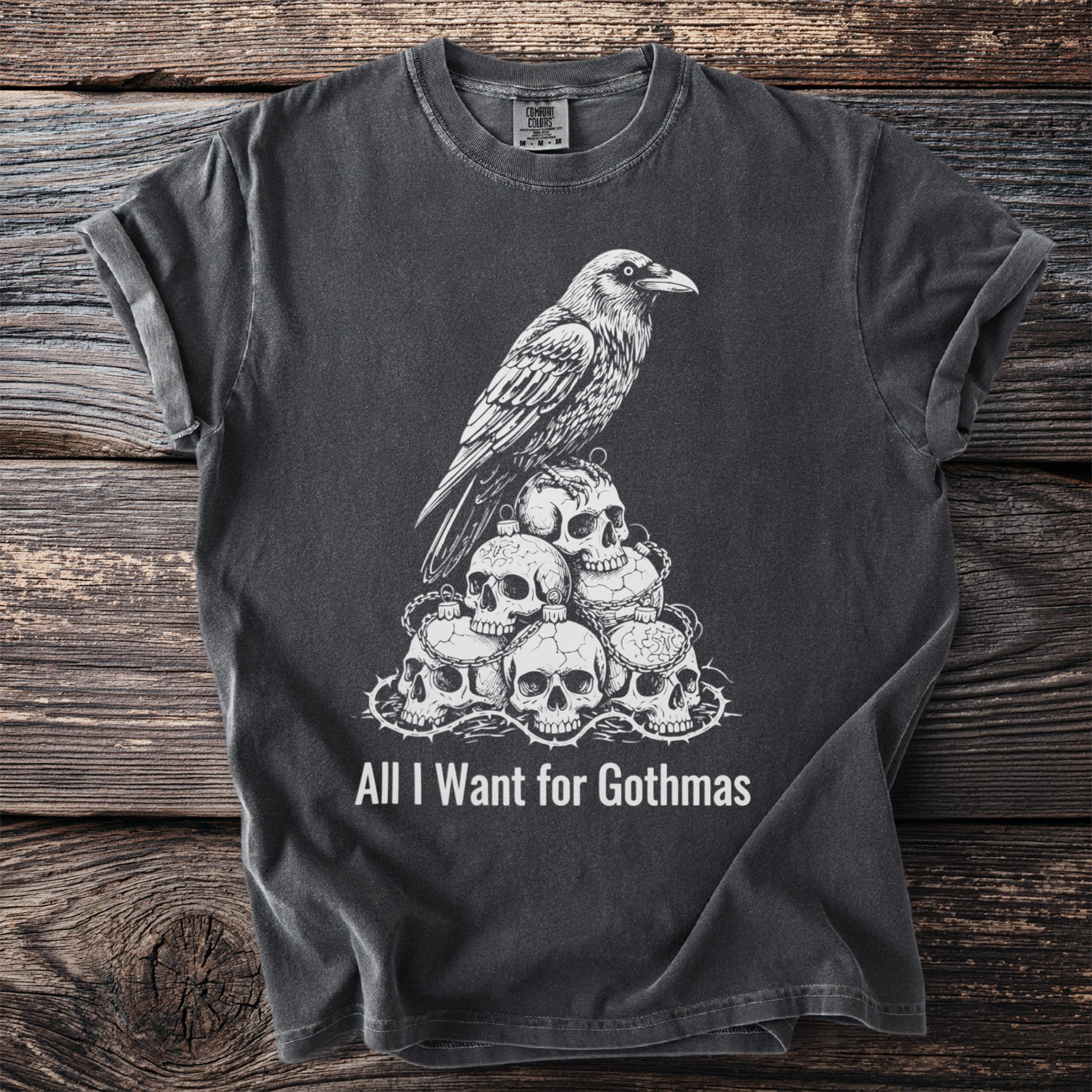 Dark t-shirt with skull and raven graphic and text "All I Want for Gothmas".