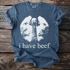 Blue t-shirt with a white graphic of a turkey and text "i have beef".