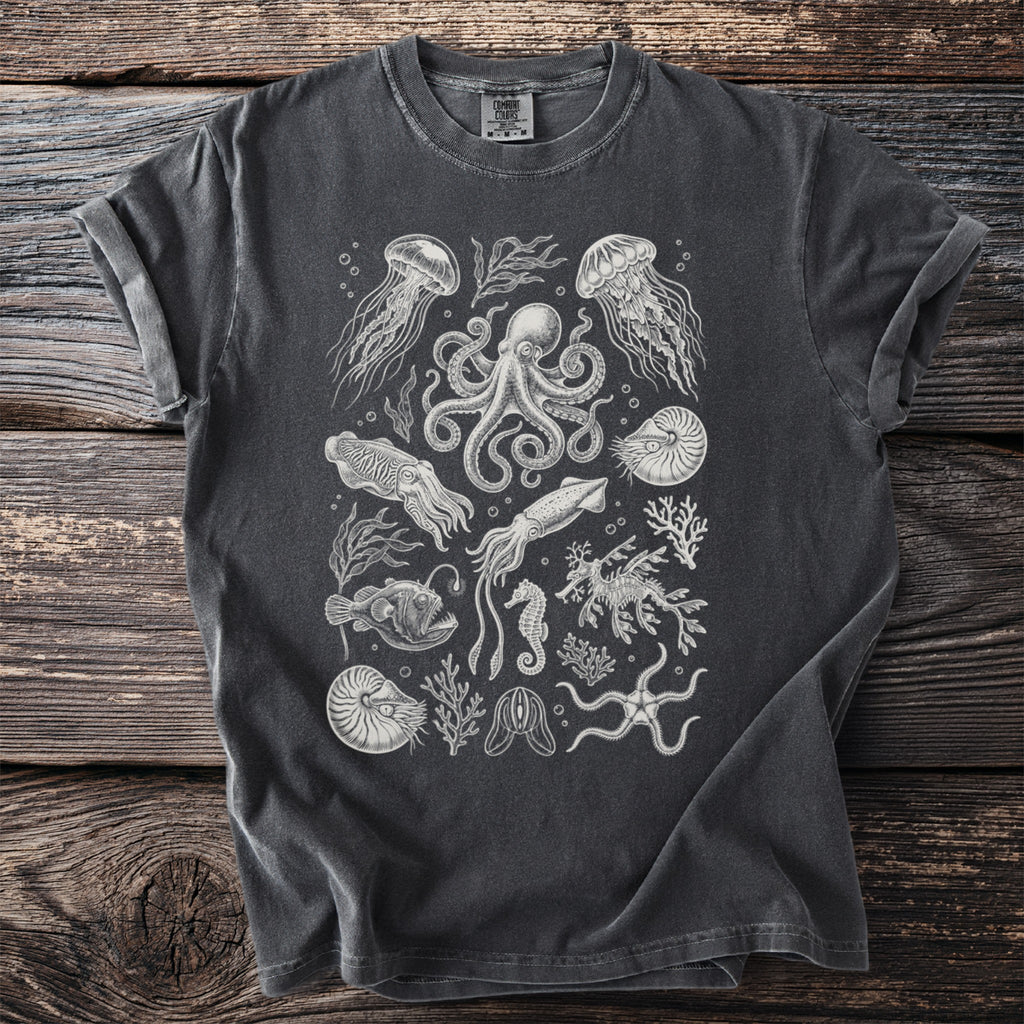 Dark gray t-shirt with an intricate white line art print of various sea creatures and coral.