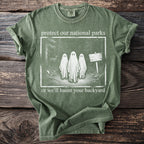 Green t-shirt with "protect our national parks" and ghosts design.