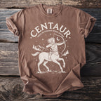 Brown t-shirt with a white graphic art of a centaur drawing a bow and arrow.