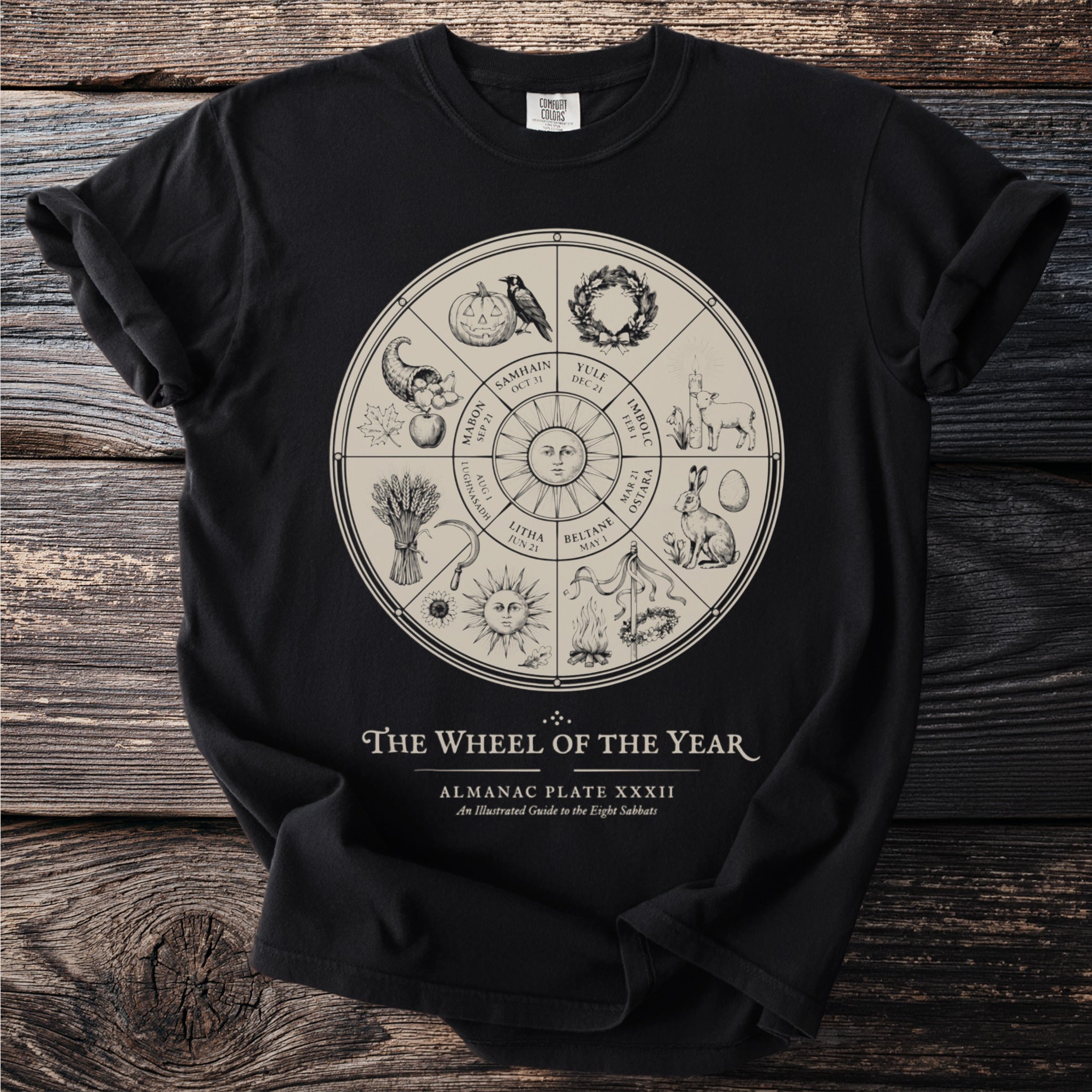 Black t-shirt with "The Wheel of the Year" illustrated almanac design.