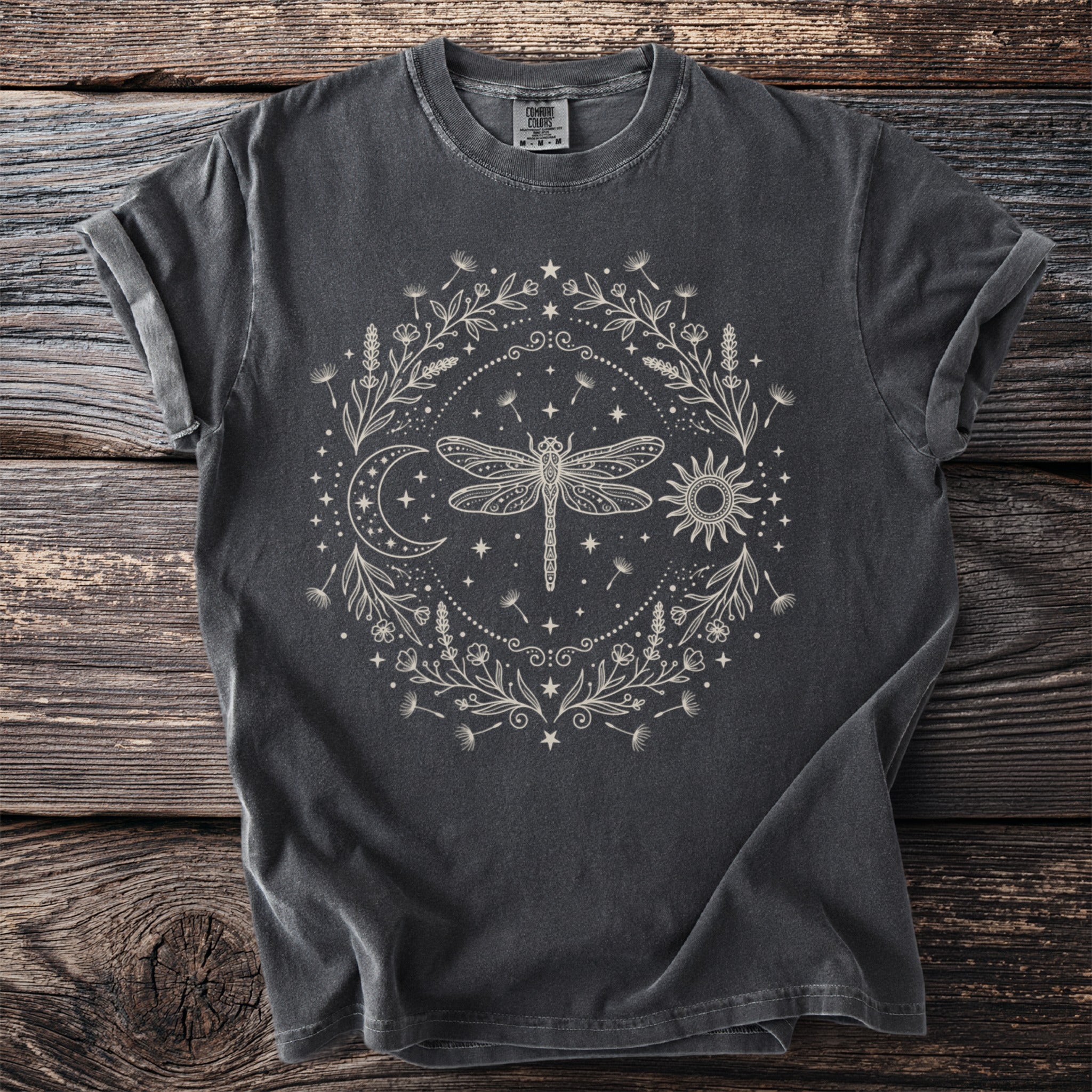 Dark gray t-shirt with a cream celestial dragonfly and floral wreath design.