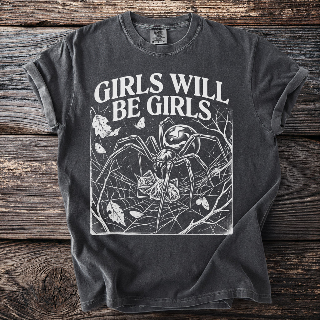 Dark t-shirt with white text "GIRLS WILL BE GIRLS" and spider graphic.