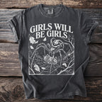 Dark t-shirt with white text "GIRLS WILL BE GIRLS" and spider graphic.