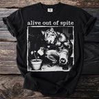 Black t-shirt with werewolf watering a plant, text "alive out of spite"