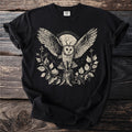 Black t-shirt with a detailed line art print of an owl with wings spread wide.