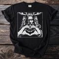 Black t-shirt with a white graphic of a crowned man with a snake and antlers forming a heart.