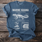 Marine Iguana scientific illustration with body length and traits on a blue t-shirt.