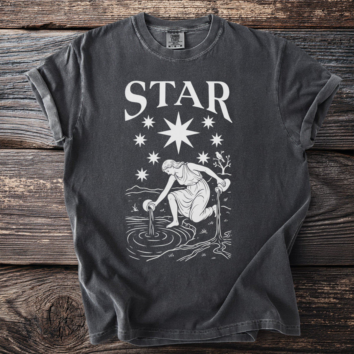 Dark grey t-shirt with white "STAR" text and constellation graphic.