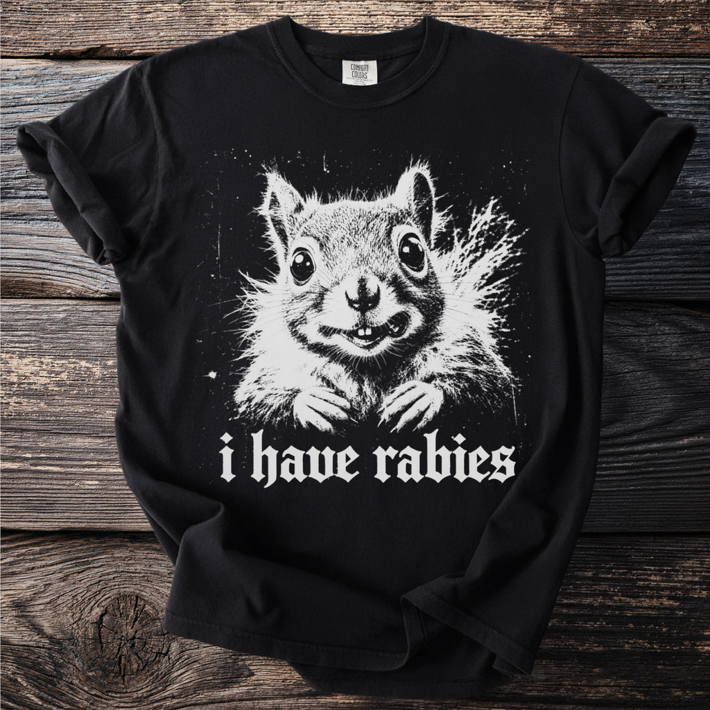 Black t-shirt with a white graphic of a squirrel and the text "i have rabies".