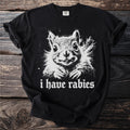 Black t-shirt with a white graphic of a squirrel and the text "i have rabies".