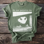 Green t-shirt with an opossum peeking out and text "do not perceive me".