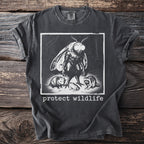 Vintage style t-shirt with moth, opossum, frog, raccoon graphic and "protect wildlife" text.
