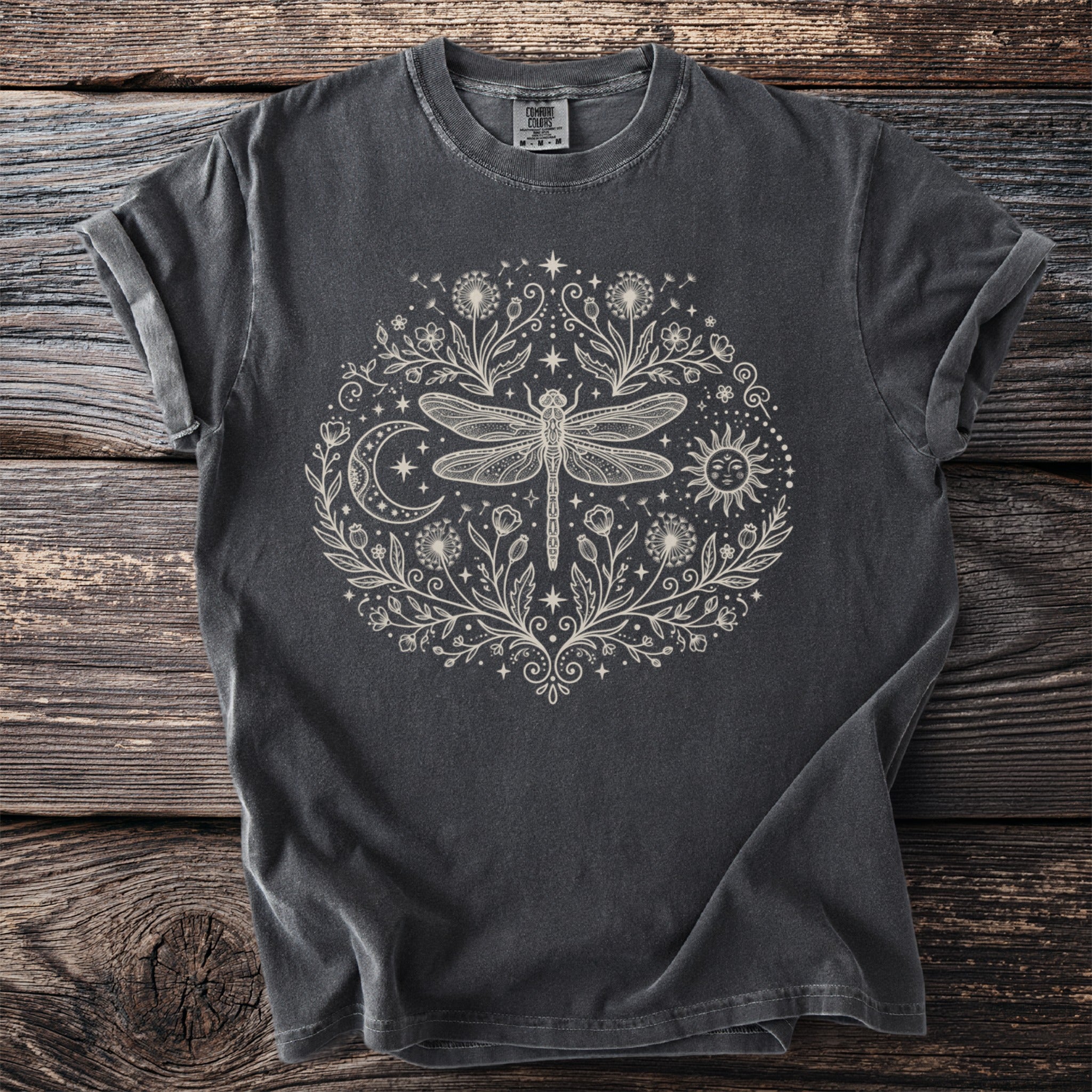Dark grey t-shirt with a circular dragonfly, sun, moon, and floral design.