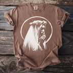 Brown t-shirt with white graphic of a figure wearing a veil and holding hands.