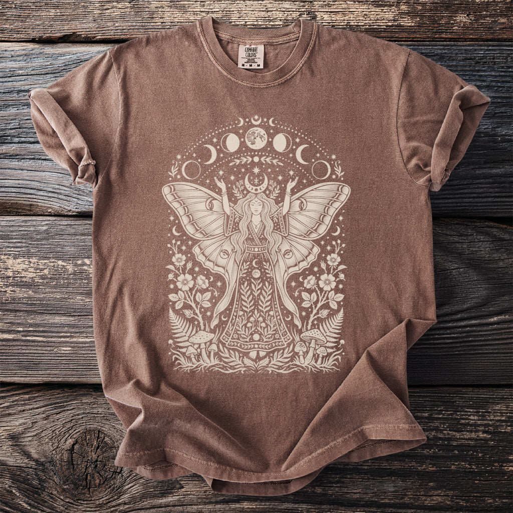 Brown t-shirt with white moth fairy, moon phases, and floral design.