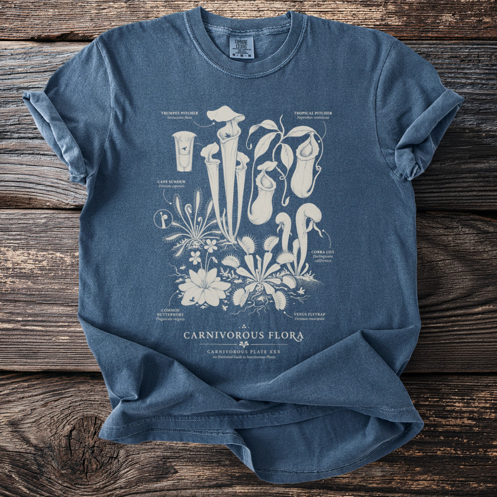 Blue t-shirt with "Carnivorous Flora" text and illustrations of various carnivorous plants.
