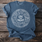 Blue t-shirt with white circular graphic of sea creatures and text "Love the Unloved".
