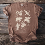 Brown t-shirt with "The Celestial Atlas" design featuring constellations Draco, Cygnus, Ursa Major, Pegasus, Ophiuchus, and Orion.