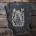 Dark t-shirt with white graphic of a figure on horseback holding an axe, surrounded by holly.