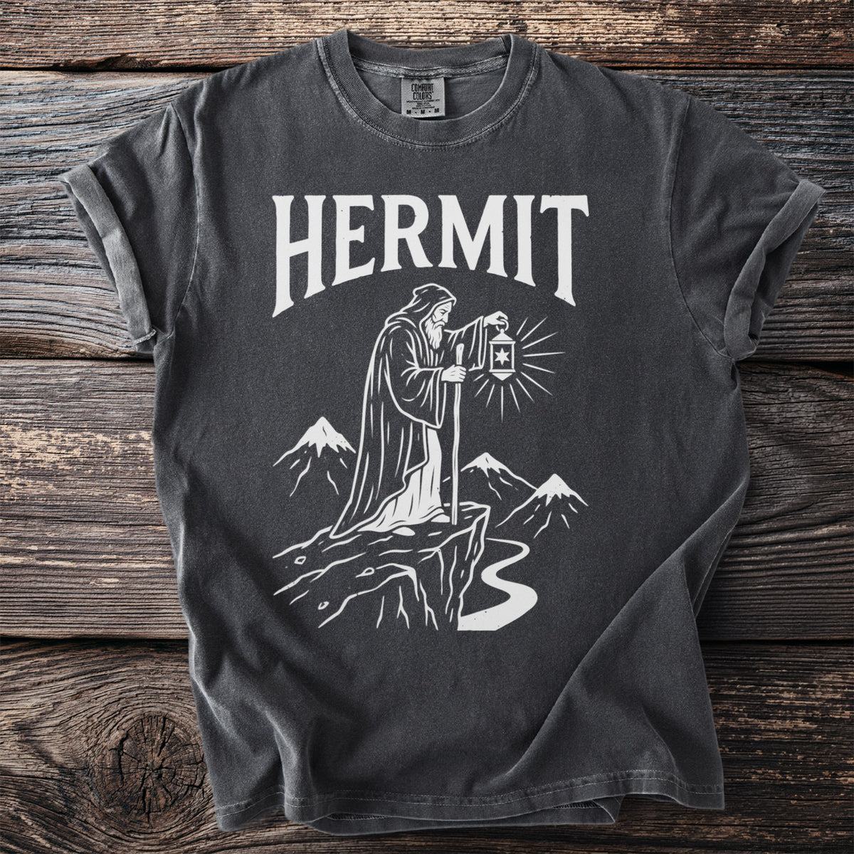 Gray t-shirt with "HERMIT" text and a robed figure holding a lantern.
