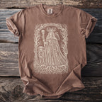 Brown t-shirt with a detailed beige illustration of a skeletal queen and her dog.