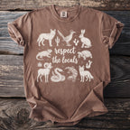 Brown t-shirt with white desert animals and "respect the locals" text.