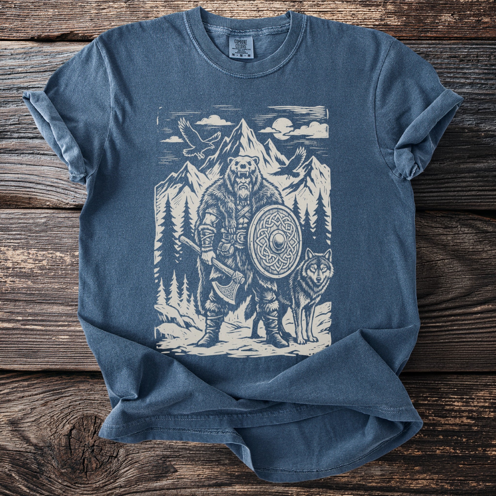 T-shirt with bear warrior, wolf, mountains, and eagles graphic.