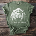 Green t-shirt with white jumping spider graphic and text "i'll keep you company."