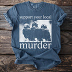 A blue t-shirt with the text "support your local murder" and three crows.