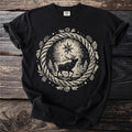Black t-shirt with a forest elk beneath a north star inside a pinecone wreath.