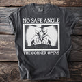T-shirt with "NO SAFE ANGLE THE CORNER OPENS" text and a creature with two figures.